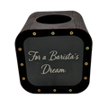 Dark wooden tip savings box with a rounded top, coin slot, transparent front panel, gold screws, and engraved text “For a Barista’s Dream”.
