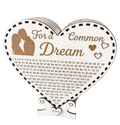 Heart-shaped wooden savings box with “For a Common Dream” engraving, couple silhouette, heart details, love tag, and a numbered savings tracker.
