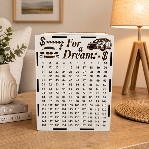 White wooden “For a Dream” car savings piggy bank standing on a wooden table in a cozy home interior with warm lighting and neutral decor.